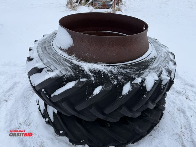 Lot 1-11633 - (1) set of used clamp on duals with Goodyear 13-38 tires, tires are weather checked and cracked.