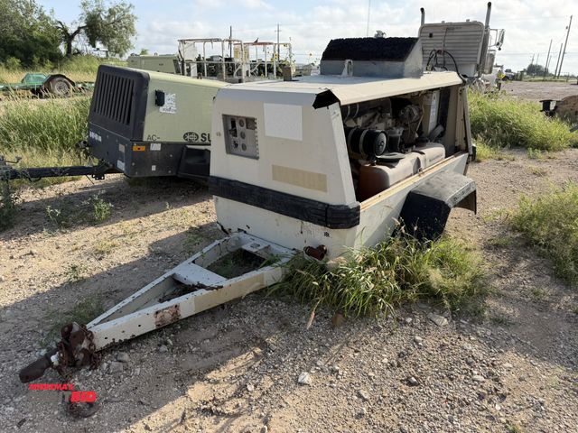 Lot 1-9537 - (1) 1997 Ingersoll-Rand 185 air compressor, model P185WJD, S/N 272308UAH221, missing tires, diesel e...