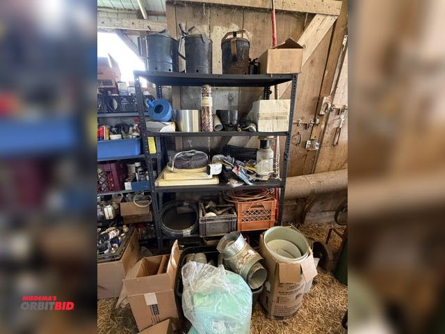 Lot 1-8510 - Rack with contents, includes oil cans, flashing, fans, copper wire, gas pipe fittings, duct work fit...