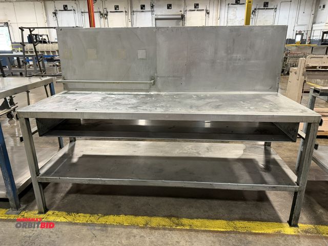 Lot 1-5134 - (1) 7' length x 36.5" height x 30" depth heavy duty steel table with 24" tall backing plate, lower s...
