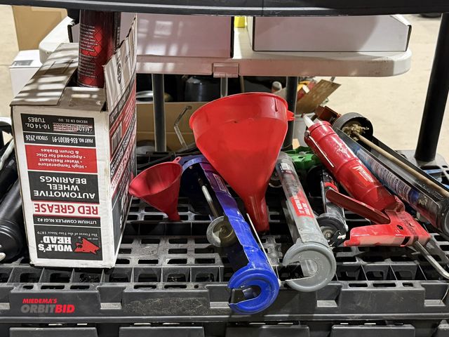 Lot 1-18554 - Lot of assorted grease and caulk guns, funnels, and (1) box of (7) new 14 oz. tubes of Wolf's Head L...