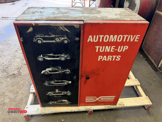 Lot 1-18589 - (1) Borg Warner 2-door automotive tune up parts cabinet, 28.5" wide x 12" deep x 31.5" tall, with co...