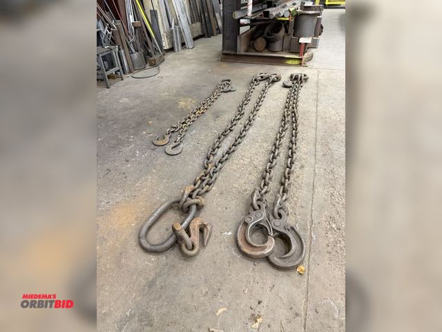 Lot 1-15374 - Lot of (3) 2 pt. lift chains, 2 @ heavy duty approx. 80" reach with 5/8" hooks, and 1 is approx. 48"...