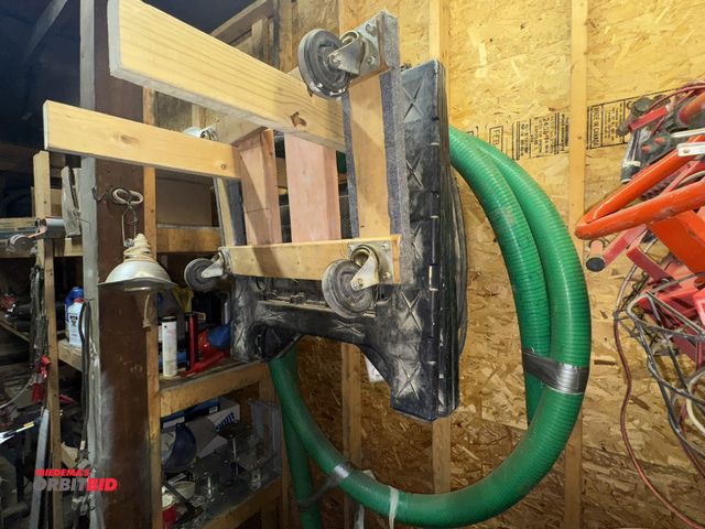 Lot 1-4556 - Lot of (2) plastic saw horses, (1) 4-wheel dolly/mover, and (1) 3" trash pump hard hose, approx. 20'...