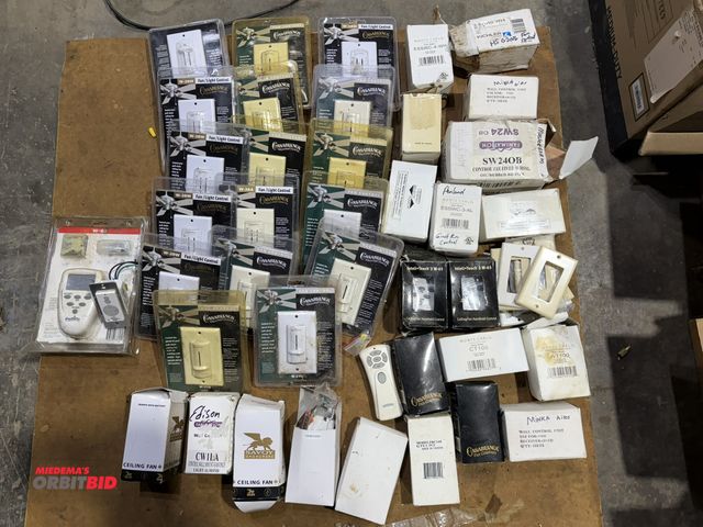 Lot 1-1523 - Large lot of new ceiling fan remotes and wall mounted control units, for fan/light control.