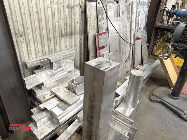 Lot 1-15377 - Large lot of assorted scrap aluminum pieces, includes 2 x 4, 6 x 6, various flat plates, and much mo...