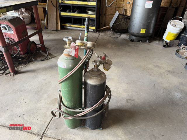 Lot 1-19923 - (1) acetylene torch set with cart, (1) oxygen tank, approx. 30" tall, (1) acetylene tank, approx. 26...