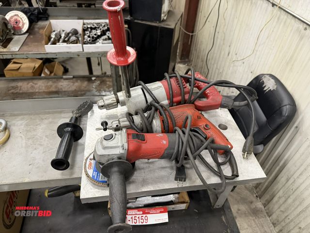 Lot 1-15162 - (1) Milwaukee 1/2" drill, (1) Milwaukee drill, and (1) 4.5" angle grinder, drills do not include key...