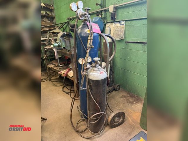 Lot 1-18809 - (1) oxygen/acetylene tank cart, tanks included, approx. 10' of hose, torch, (2) tanks, and 2-wheel d...