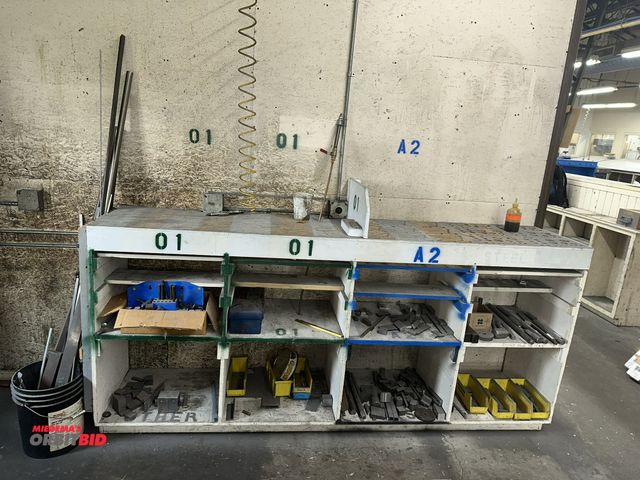 Lot 1-17698 - (1) 96" width x 43.5" height x 21" depth wood cabinet full of assorted steel, hold down tools, and m...