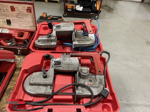 Lot 1-19359 - Lot of (2) Milwaukee heavy duty band saws, 1 with blade, 1 without, both with a case.
