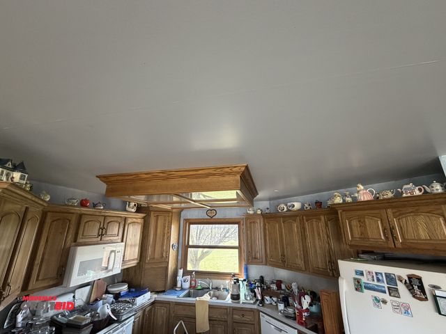 Lot 1-19169 - All tea pots above kitchen cabinets, approx. (35), winning bidder responsible for proper removal.