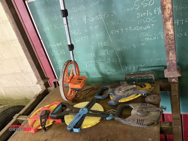 Lot 1-18207 - Lot including (1) Keson, model RR318N, portable roller type measuring tool, (2) 300' tape measures, ...