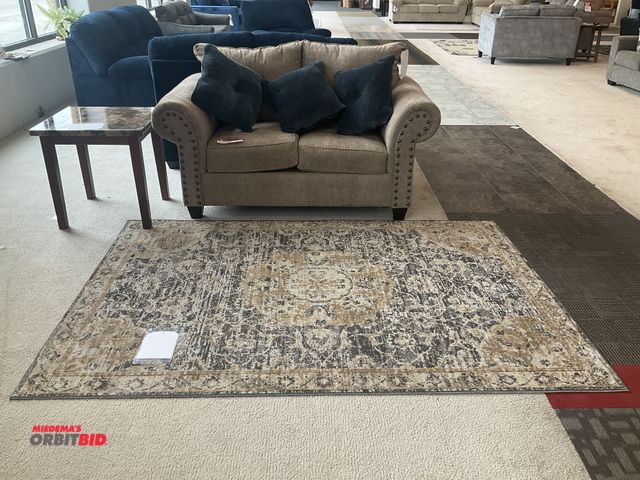 Lot 1-17158 - Beige love seat with (3) pillows, end table and area rug. Loveseat is 64” by 37” deep. End table is ...