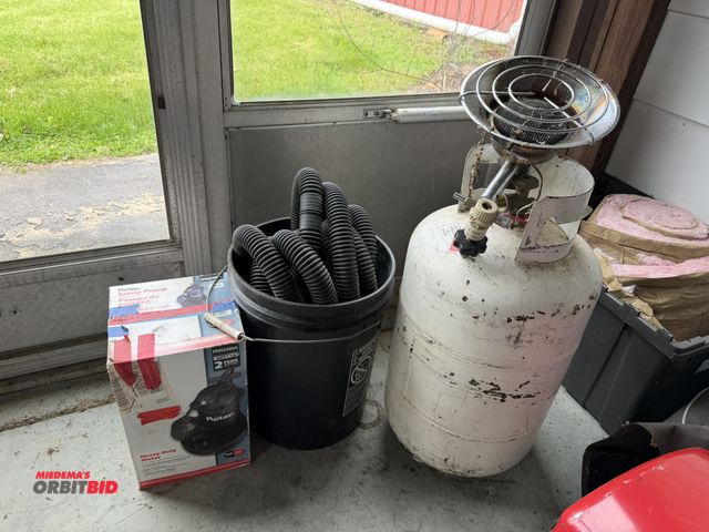 Lot 1-12158 - (1) 30 lb. propane tank with Mr. Heater attachment, includes 1/3 HP Flotec sump pump with hose.