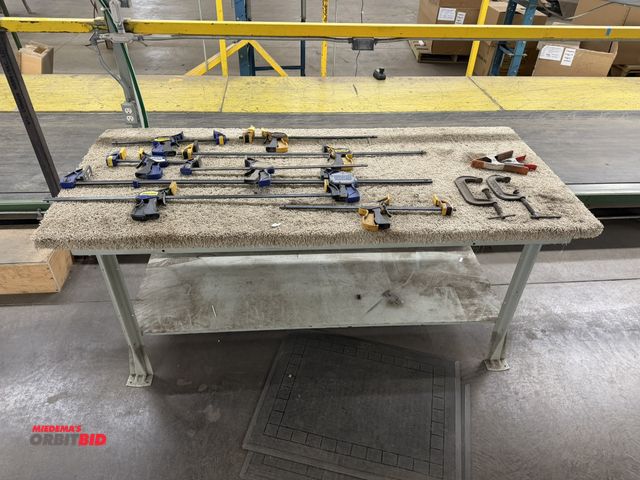 Lot 1-17410 - (1) 72" width x 35" height x 34" depth steel framed work bench with carpeted plywood top, and assort...