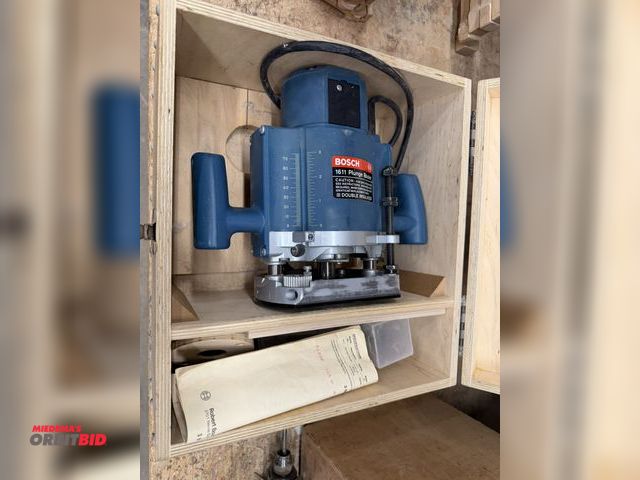 Lot 1-16589 - (1) Bosch, model 1611, plunge router with manual, accessories, and wood case.