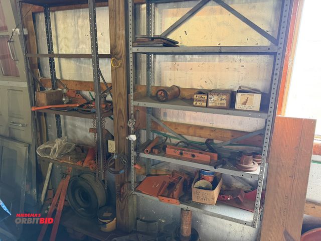 Lot 1-12332 - (2) shelves of assorted Allis Chalmers tractor parts, pieces, brackets, and more, winning bidder res...