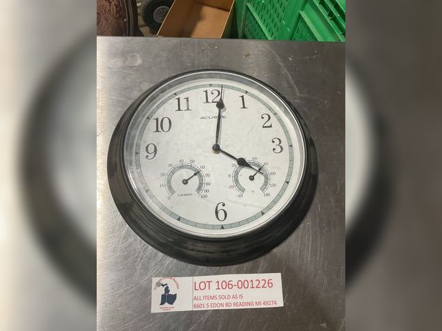 Lot 106-001226 - One Acurite wall clock. Missing battery cover.  Has temperature and humidity gauge on the face of cl...