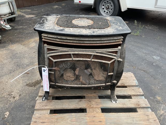 Lot 106-001207 - Propane fireplace with fake wood.