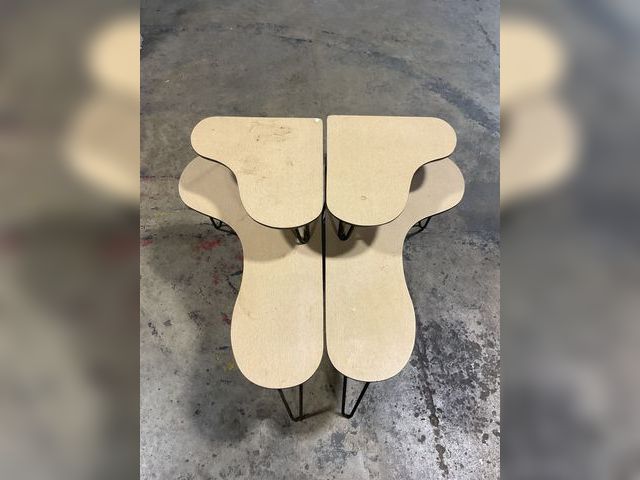 Lot 106-001201 - Two matching wood end tables with cast iron legs.