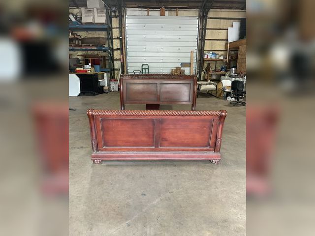 Lot 106-001241 - Dark wood bedroom set. Sleigh bed, dresser and mirror