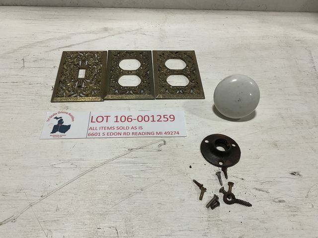 Lot 106-001259 - Set of 3 gold colored outlet covers. One white doorknob with hardware. All vintage according to owne...