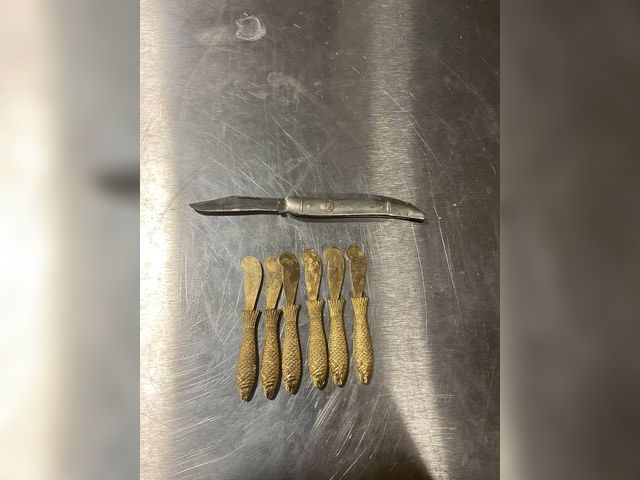 Lot 106-001214 - Set of 6 gold plated fish spread knives. One silver pocket knife. One moon pie container.