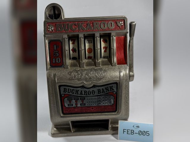 Lot 108-05 - VINTAGE TOY BUCKAROO BANK SLOT MACHINE JACKPOT