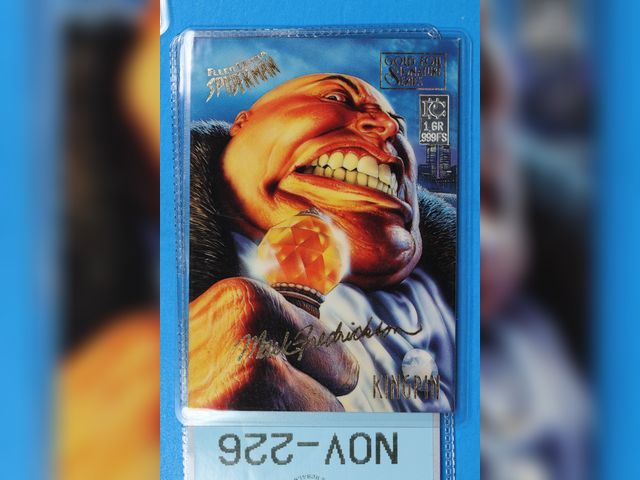 Lot 108-226 - 1 GRAIN 999 SILVER BAR ATTACHED TO A FLEER ULTRA SPIDERMAN CARD KINGPIN