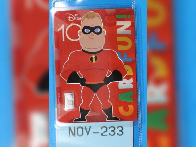 Lot 108-233 - 1 GRAIN 999 SILVER BAR ATTACHED TO A DISNEY 100 MR INCREDIBLES CARD