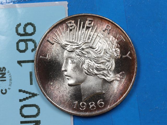 Lot 108-196 - 1986 DATED 1oz 999 SILVER BULLION COIN ROUND PEACE DOLLAR DESIGN COLOR TONED