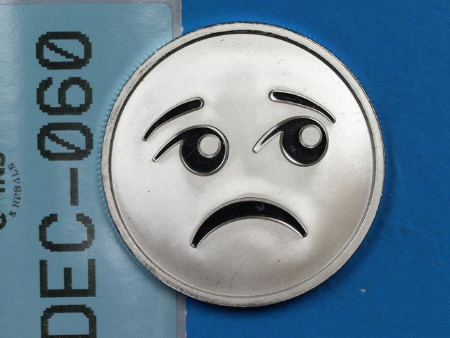 Lot 108-060 - 1oz FINE SILVER EMOJI SAD FACE SILVER 999 ONE TROY OUNCE SILVER