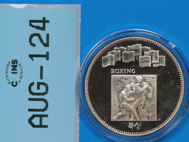 Lot 108-124 - 1988 CC 1oz SILVER ROUND OLYMPIC BOXING SILVER ONE TROY OUNCE FINE SILVER SEOUL, KOREA COMMEMORATE X...