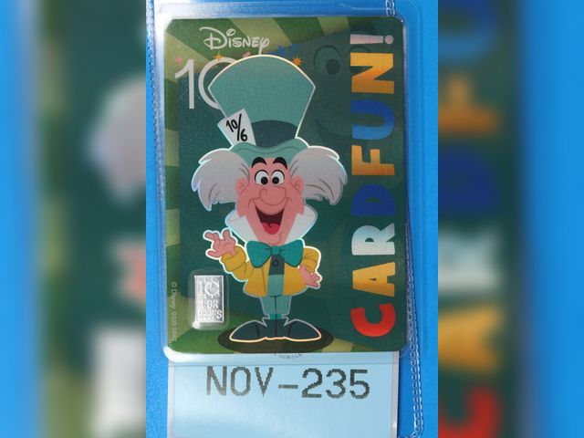 Lot 108-235 - 1 GRAIN 999 SILVER BAR ATTACHED TO A DISNEY 100 MAD HATTER CARD