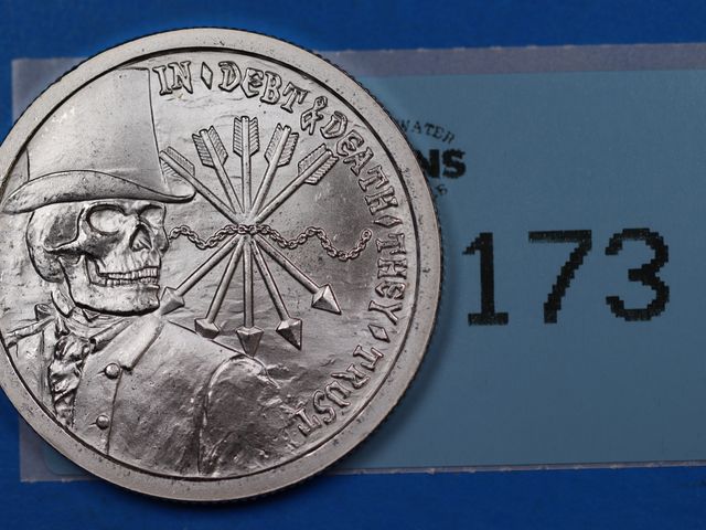 Lot 108-173 - 2012 1oz 999 SILVER BULLET SILVER SHIELD SBSS PROOF SKULL DEATH AND DEBT