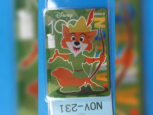 Lot 108-231 - 1 GRAIN 999 SILVER BAR ATTACHED TO A DISNEY 100 ROBIN HOOD CARD