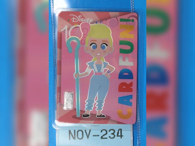 Lot 108-234 - 1 GRAIN 999 SILVER BAR ATTACHED TO A DISNEY 100 BO PEEP TOY STORY CARD