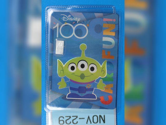 Lot 108-229 - 1 GRAIN 999 SILVER BAR ATTACHED TO A DISNEY 100 PIXAR TOY STORY