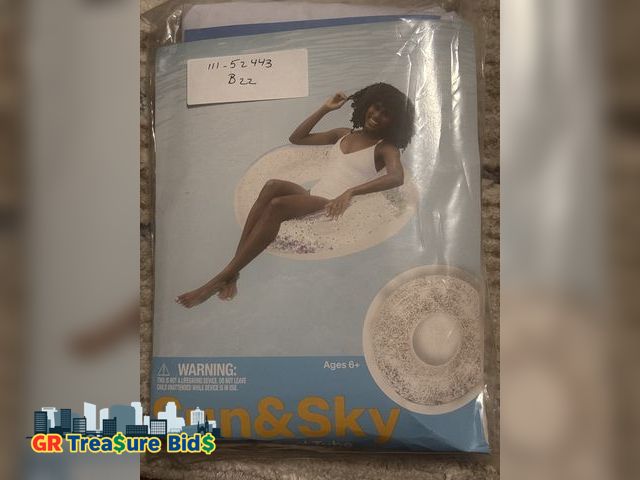 Lot 111-52443 - Sun and sky beach and pool tube holographic glitter inside. 42” dia. (106.7cm).