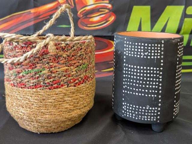 Lot 112-0508-23A - (1)  black and white ceramic planter. (1) hanging planter. Gently used. Good condition.