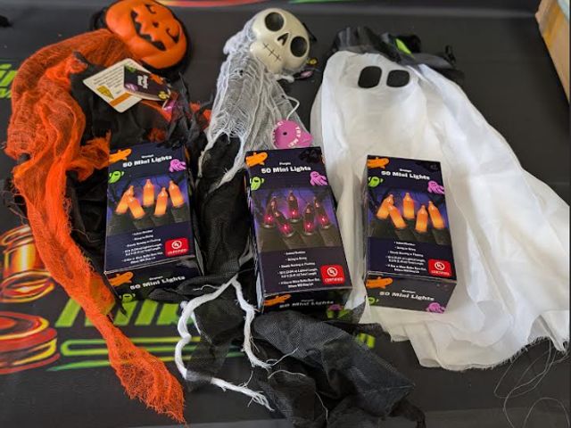 Lot 112-0530-23B-1 - Assorted Halloween decorations. Includes (3) packs of 50 mini lights, (1) light-up hanging ghost, (1...