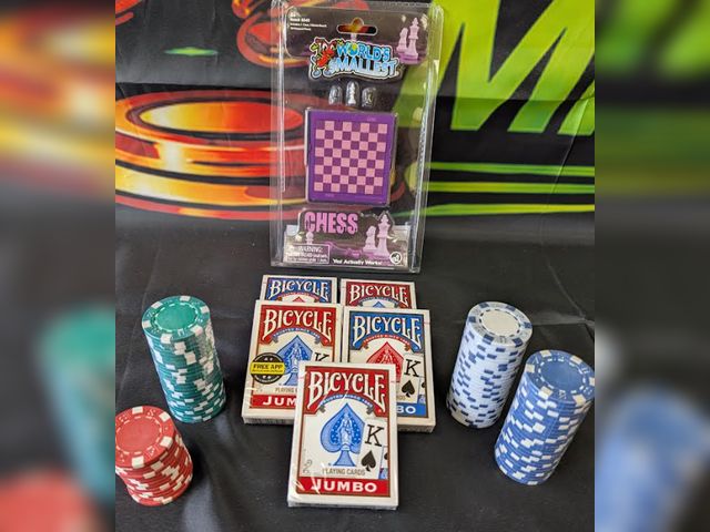 Lot 112-0501-23A - Mixed lot. Includes 5 new decks of playing cards, poker chips and a mini chess game.