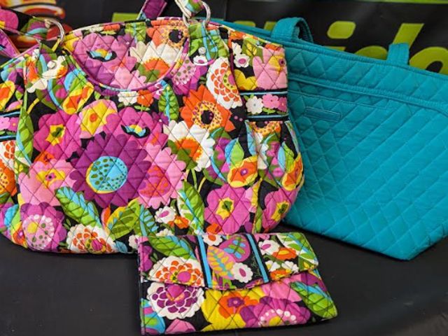 Lot 112-0291-22C - 2 gently used Vera Bradley purses and a matching wallet. Very clean.