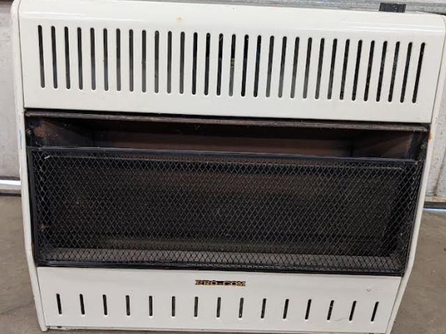 Lot 112-0513-garage - Wall heater ProCom wall hanging ventless propane heater. Used.