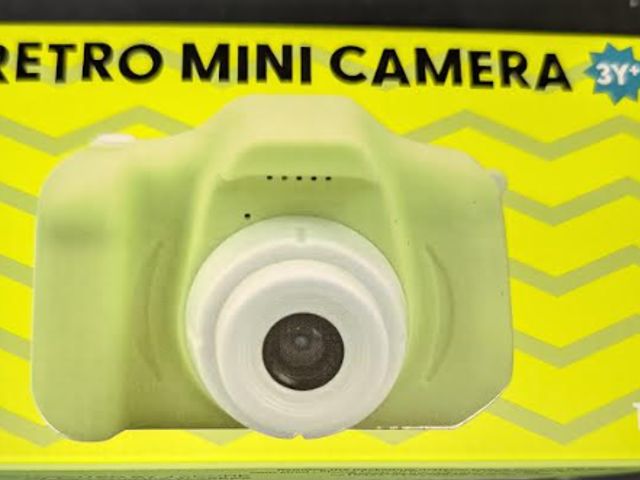 Lot 112-0265-22B - Retro mini camera with USB cable for charging. Green. New.