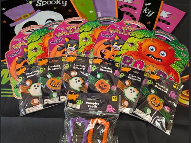 Lot 112-0528-23B-1 - Assorted kids Halloween lot. Includes (6) Trick or treat bags, (6) Flashing bracelets, (1) 8 pack of...