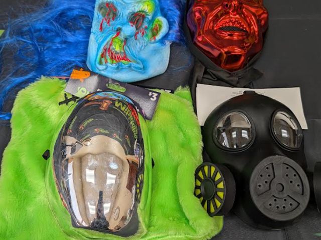 Lot 112-0568-31C-1 - Lot of 4 assorted Halloween masks and one trick or treat bag. New.