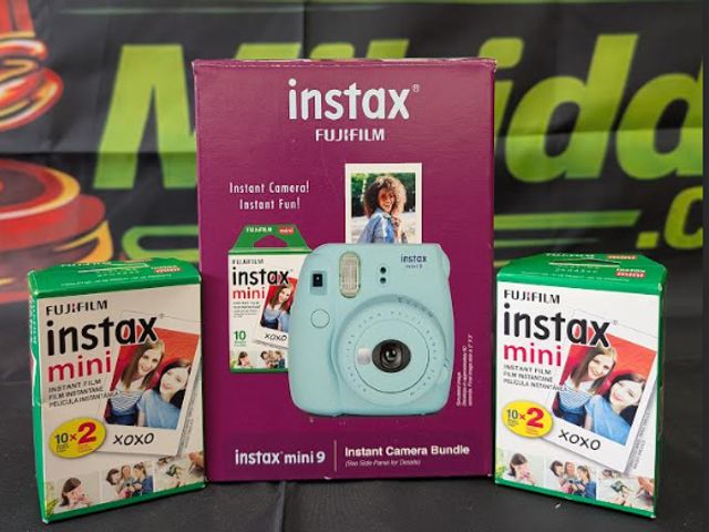 Lot 112-0268-22B - Fujifilm instax. light blue. Included with camera - silicone mini camera sleeve, 2 new rolls of film...