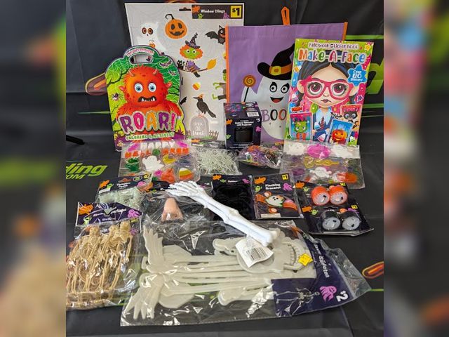 Lot 112-0526-23B-1 - Assorted Halloween lot. Includes (1) trick or treat bag, (1) light up bracelet, (1) sticker book, (1...